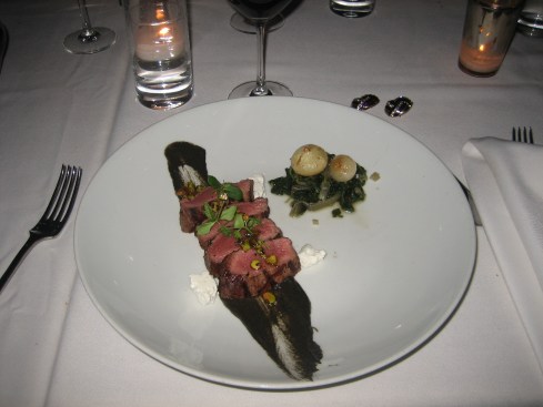 Pan-roasted duck breast with sesame soy dressing, cassava chips, wokked bok choy and pickled shallots